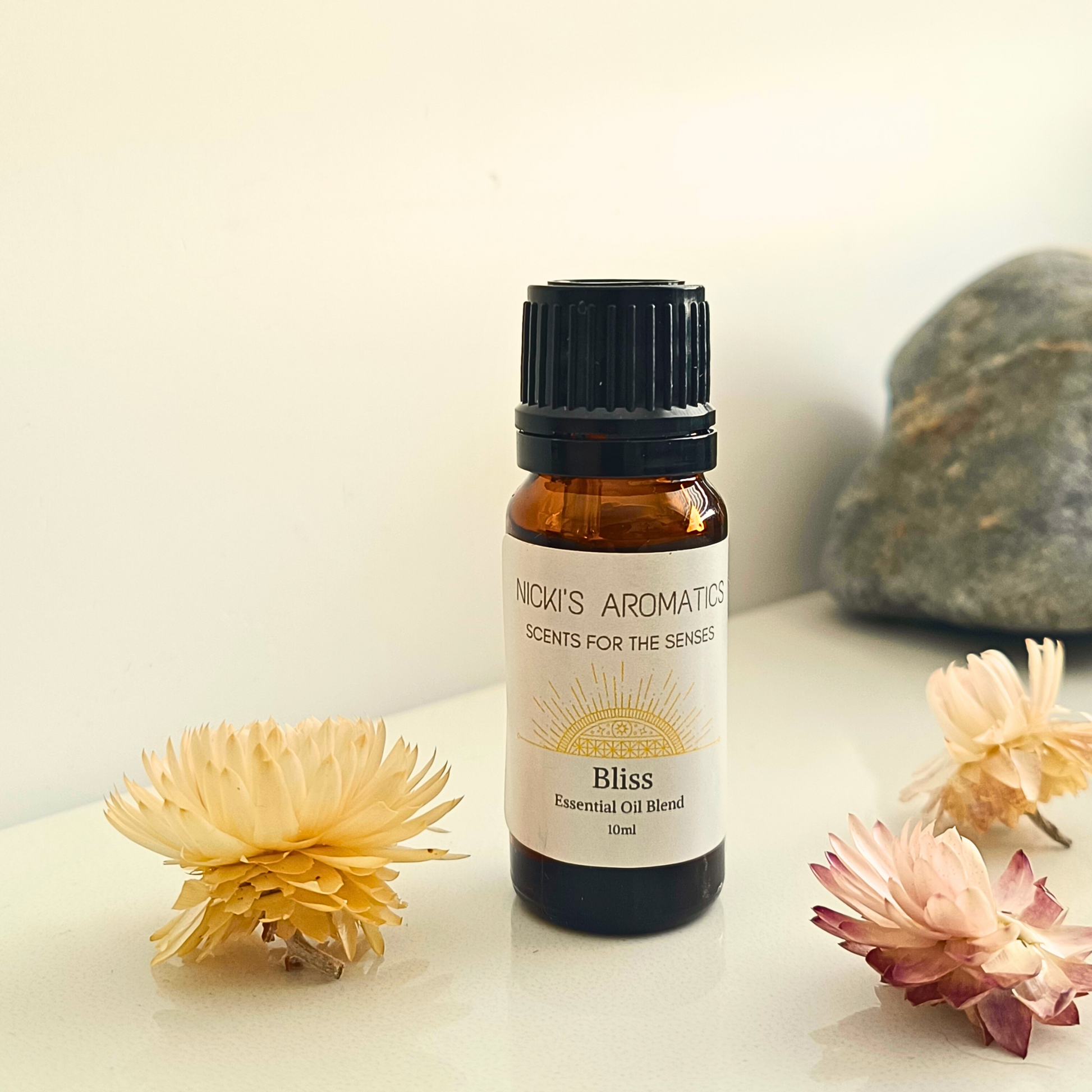 Bliss essential oil in a 10ml amber glass bottle