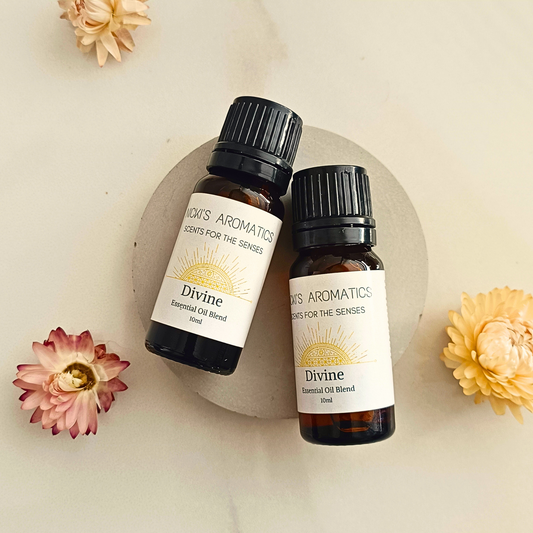 Two 10ml amber glass bottles of Divine essential oil blend