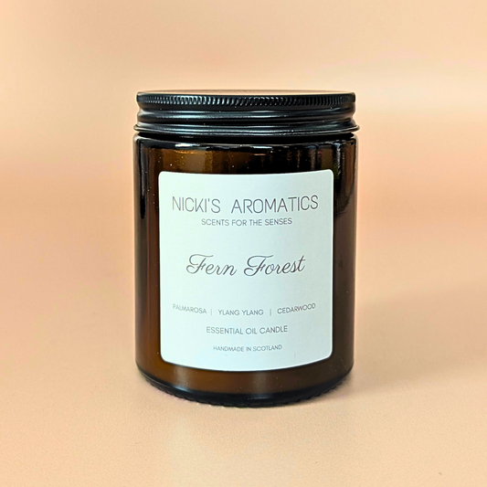 Fern Forest essential oil candle with palmarosa, ylang-ylang and cedarwood in an amber glass jar