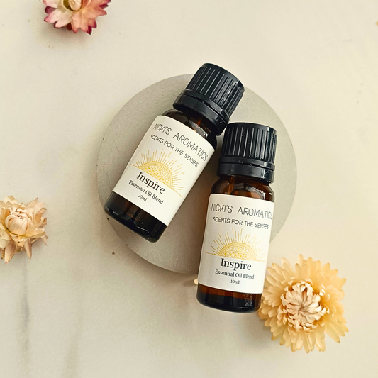 Two 10ml amber glass bottles of Inspire essential oil blend