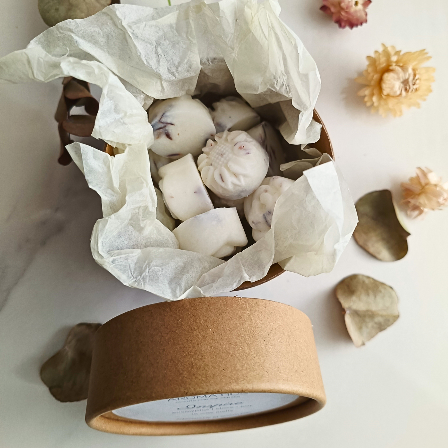 an open tube of 10 Inspire essential oil wax melts