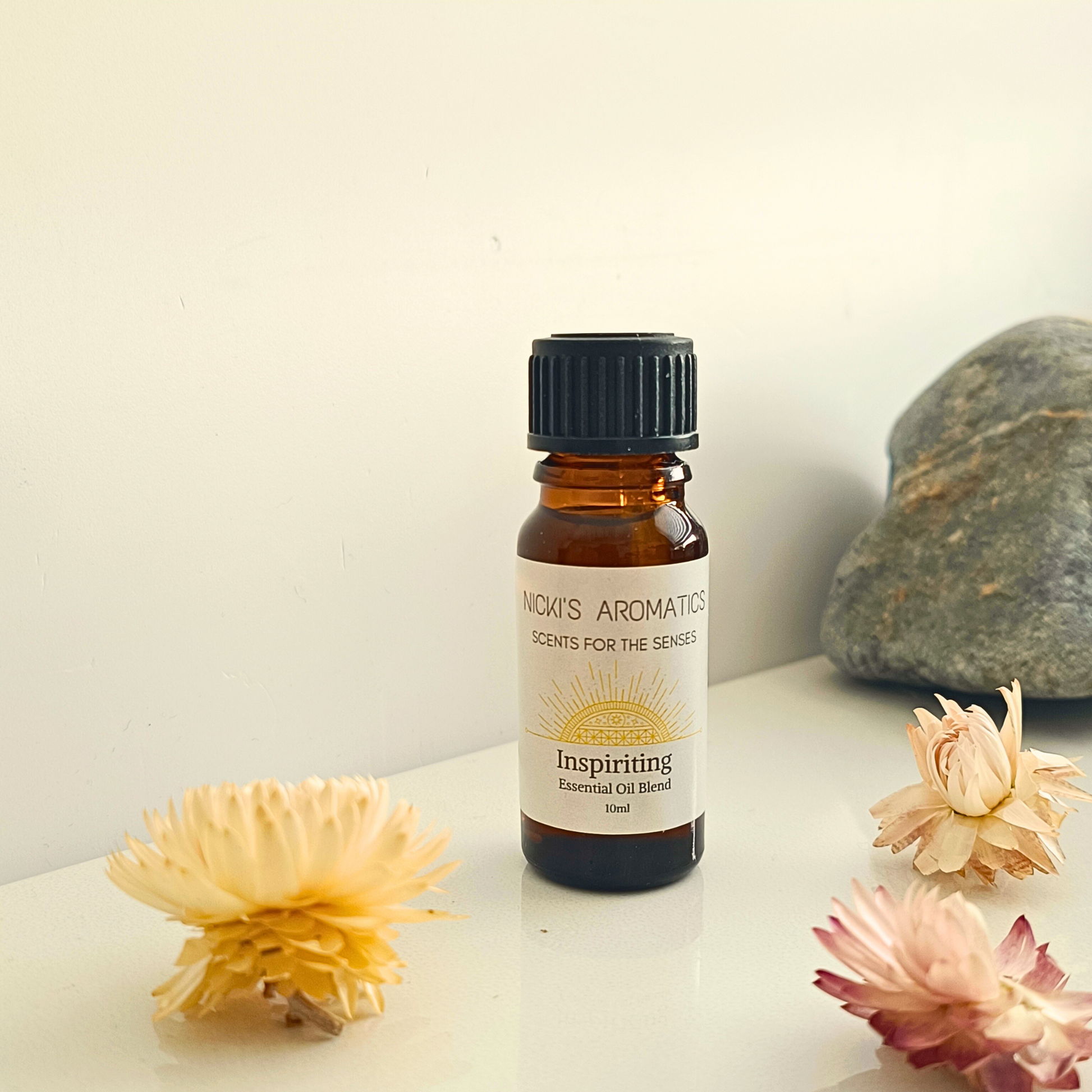 A 10ml bottle of Inspiriting essential oil blend