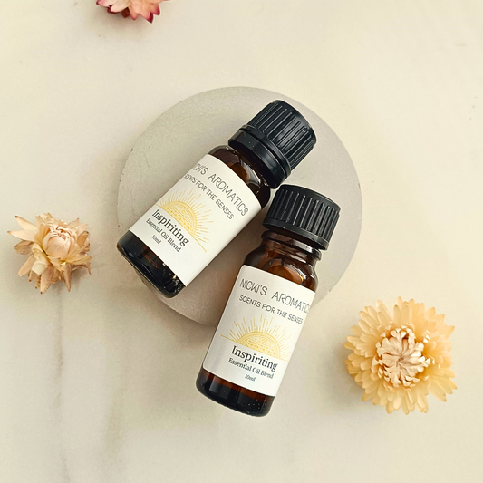 Two 10ml amber glass bottes of Inspiriting essential oil blend