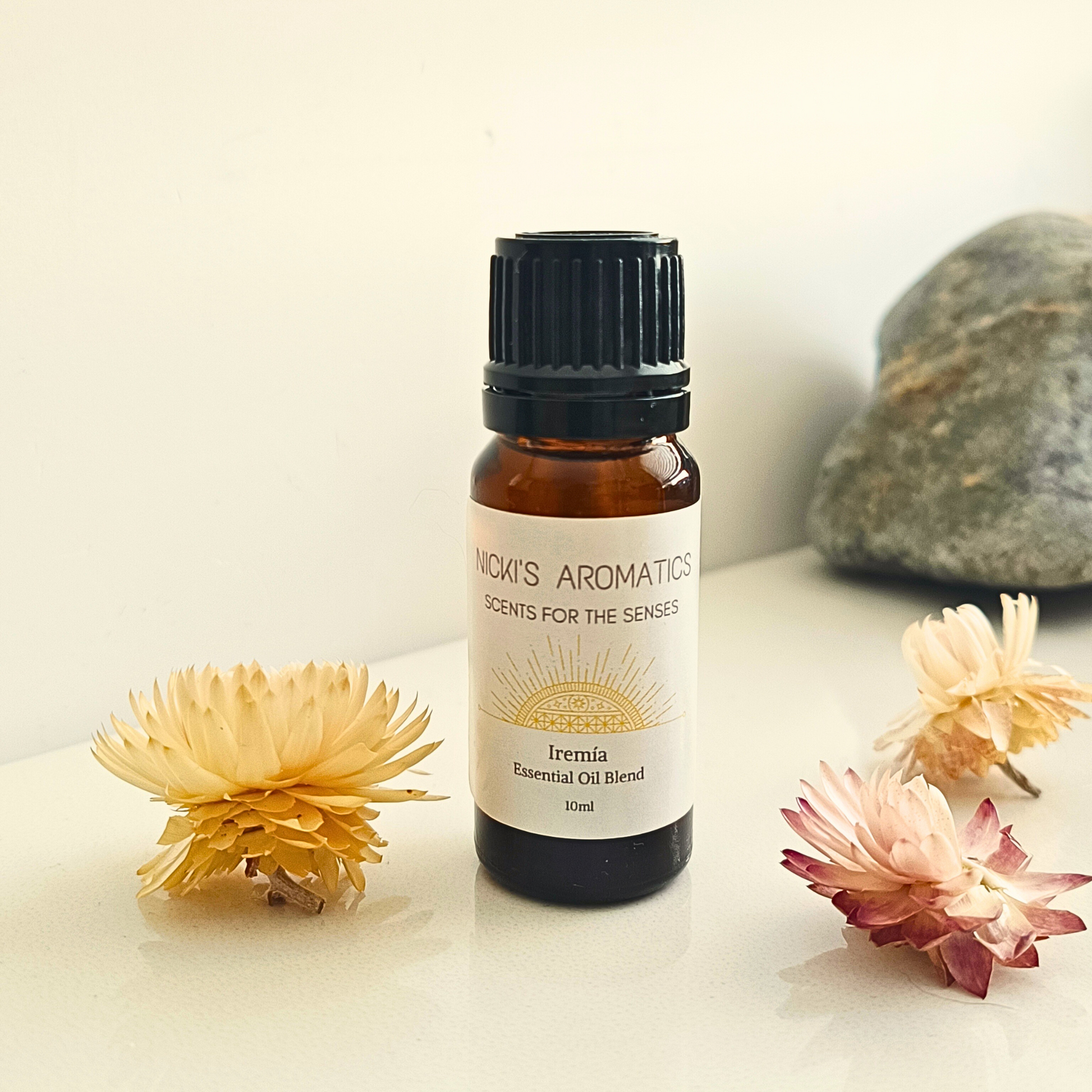 A 10ml amber bottle of Iremia essential oil blend
