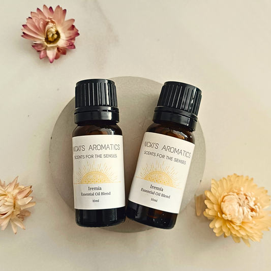 two 10ml amber glass bottles of Iremia essential oil blend