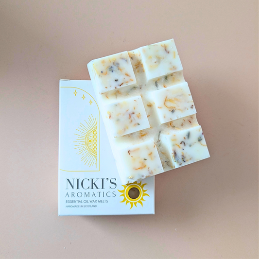 Lavender Dream essential oil wax melt bar with botanical details in Nicki’s Aromatics packaging