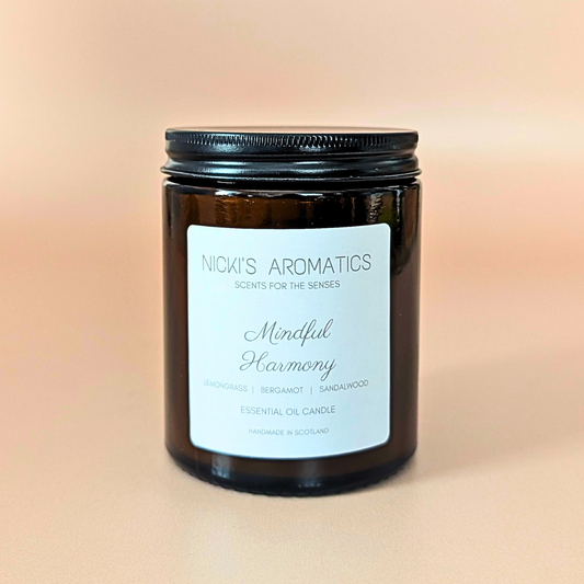 Mindful Harmony essential oil candle with lemongrass, Sandalwood and bergamot in an amber glass jar