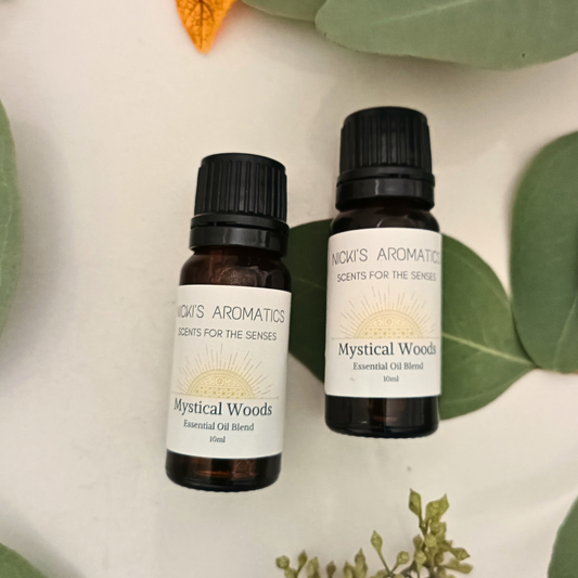 two 10ml amber glass bottles of Mystical Woods essential oil blend