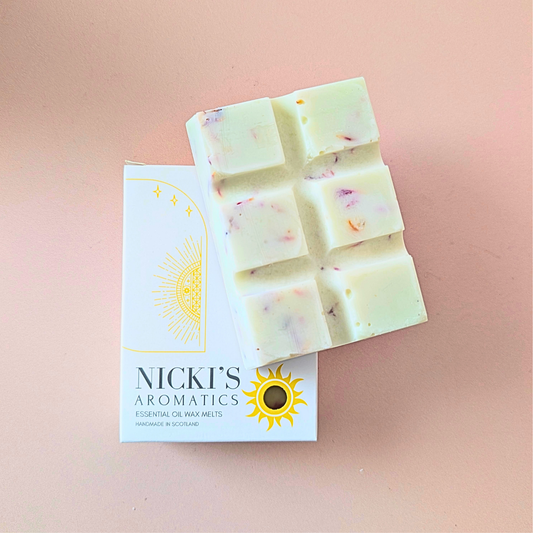 Mystical Woods essential oil wax melt bar with botanical details in Nicki’s Aromatics packaging