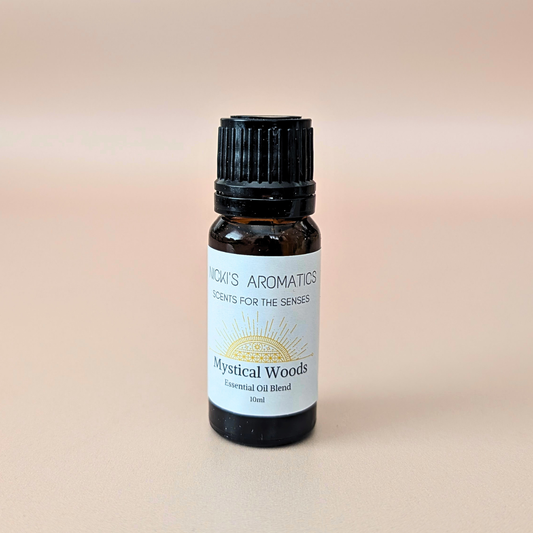 Aurora Grove pure essential oil blend with grapefruit, rosewood and cedarwood in a 10ml amber glass bottle