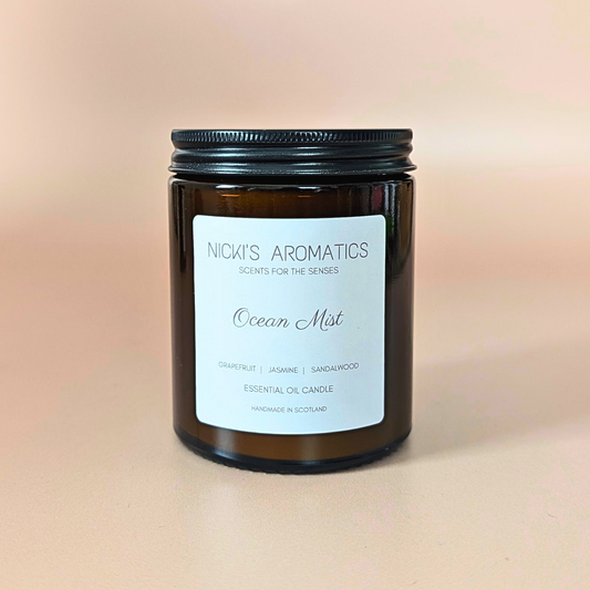 Ocean Mist essential oil candle with grapefruit, jasmine and sandalwood in an amber glass jar