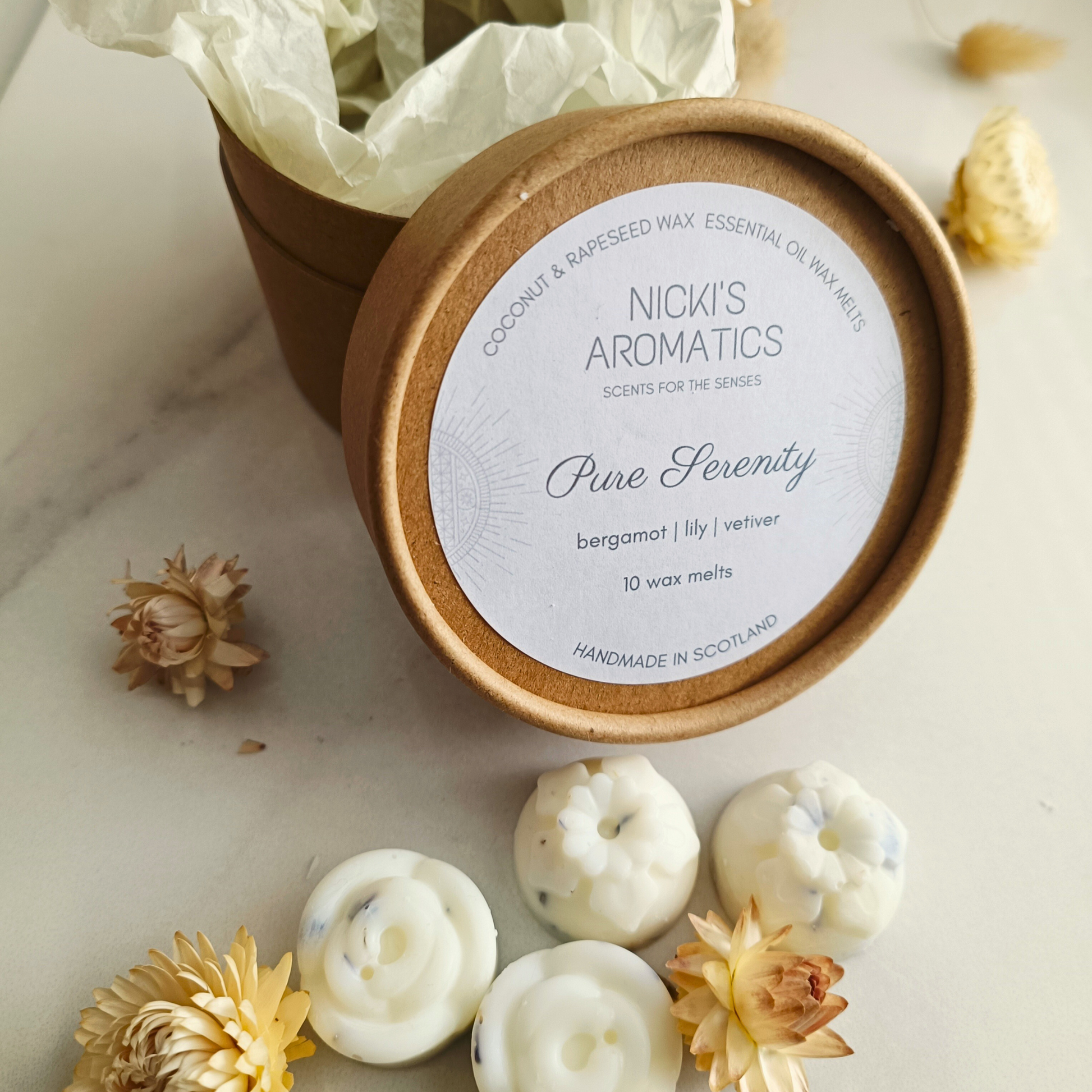 An open kraft tube of Pure Serenity essential oil wax melts