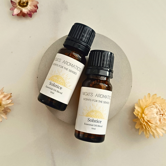 two 10ml amber glass bottle of Solstice lime basil and mandarin essential oil blend