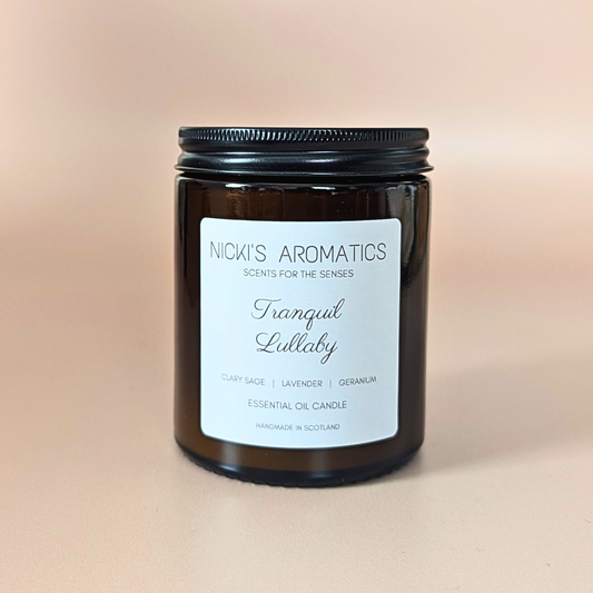 Tranquil Lullaby essential oil candle with clary sage, lavender and geranium in an amber glass jar