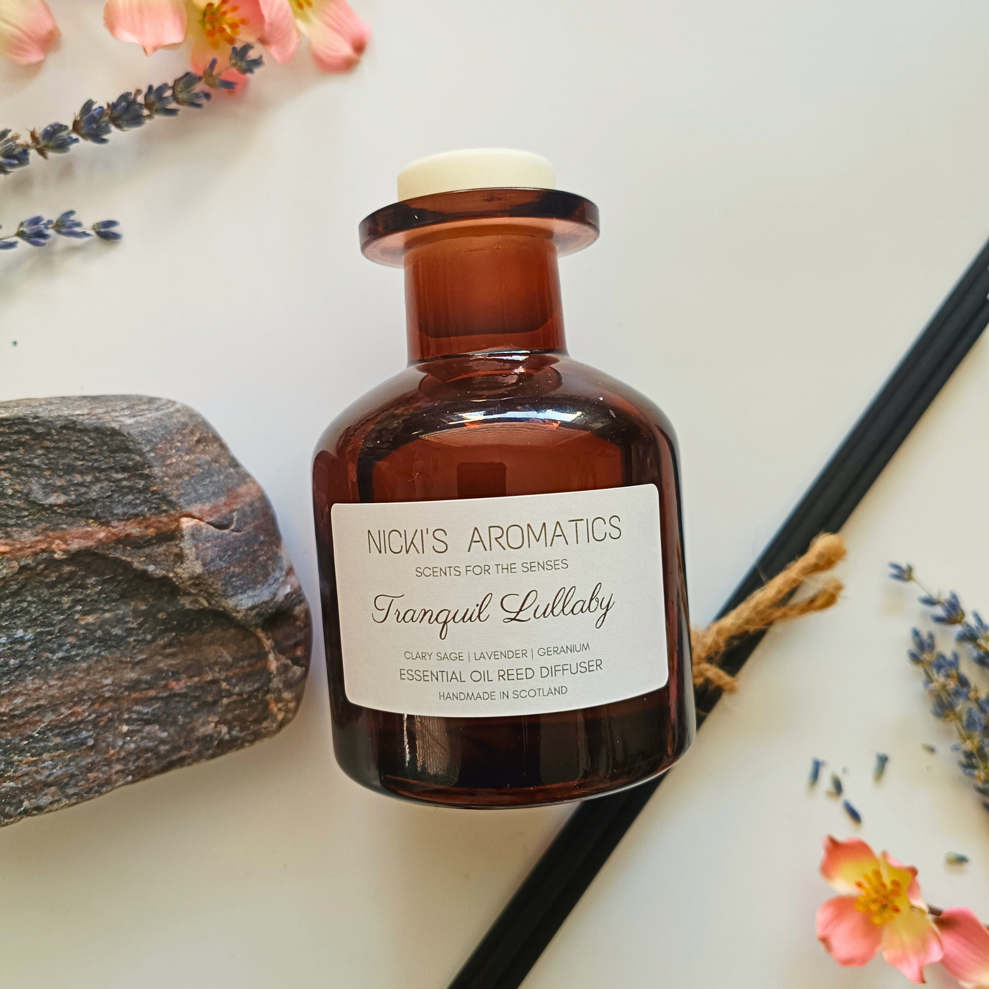 natural essential oil reed diffuser in apothecary style amber glass bottle