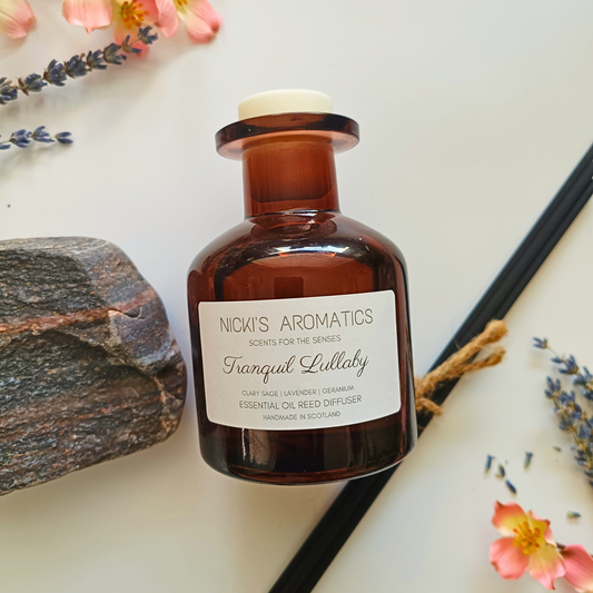 natural essential oil reed diffuser in apothecary style amber glass bottle