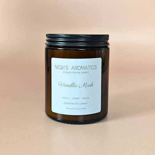 Vanilla Musk essential oil candle with neroli, juniper and vanilla in an amber glass jar