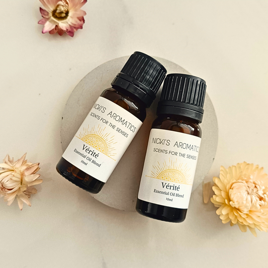 Two 10ml amber glass bottles of Verite essential oil blend