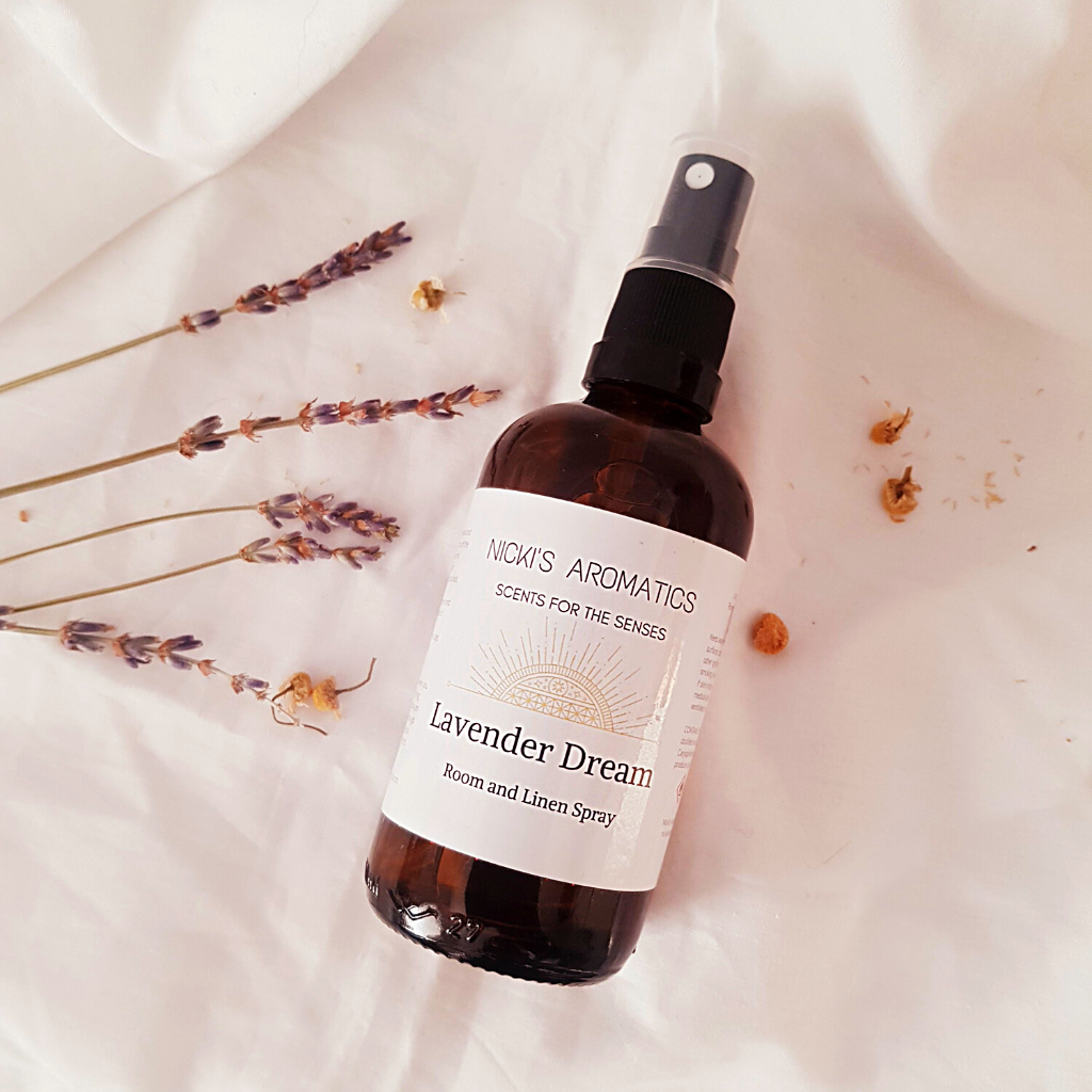 Lavender Dream room linen and pillow spray in a 100ml amber glass bottle on a white sheet