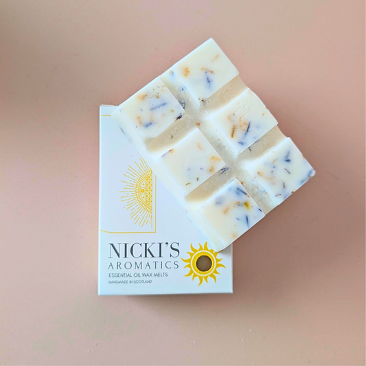 Aurora Grove essential oil wax melt bar with botanical details in Nicki’s Aromatics packaging