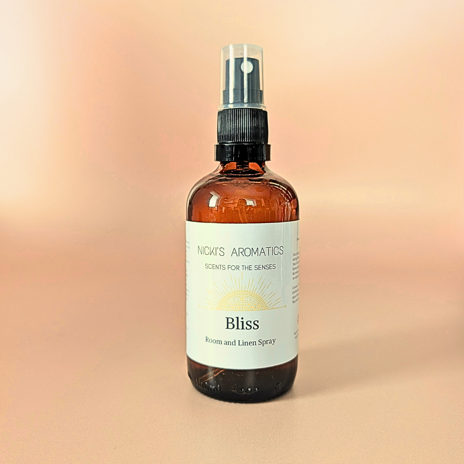 Bliss natural room and linen spray with bergamot, ylang-ylang and gingerlily in an amber glass bottle
