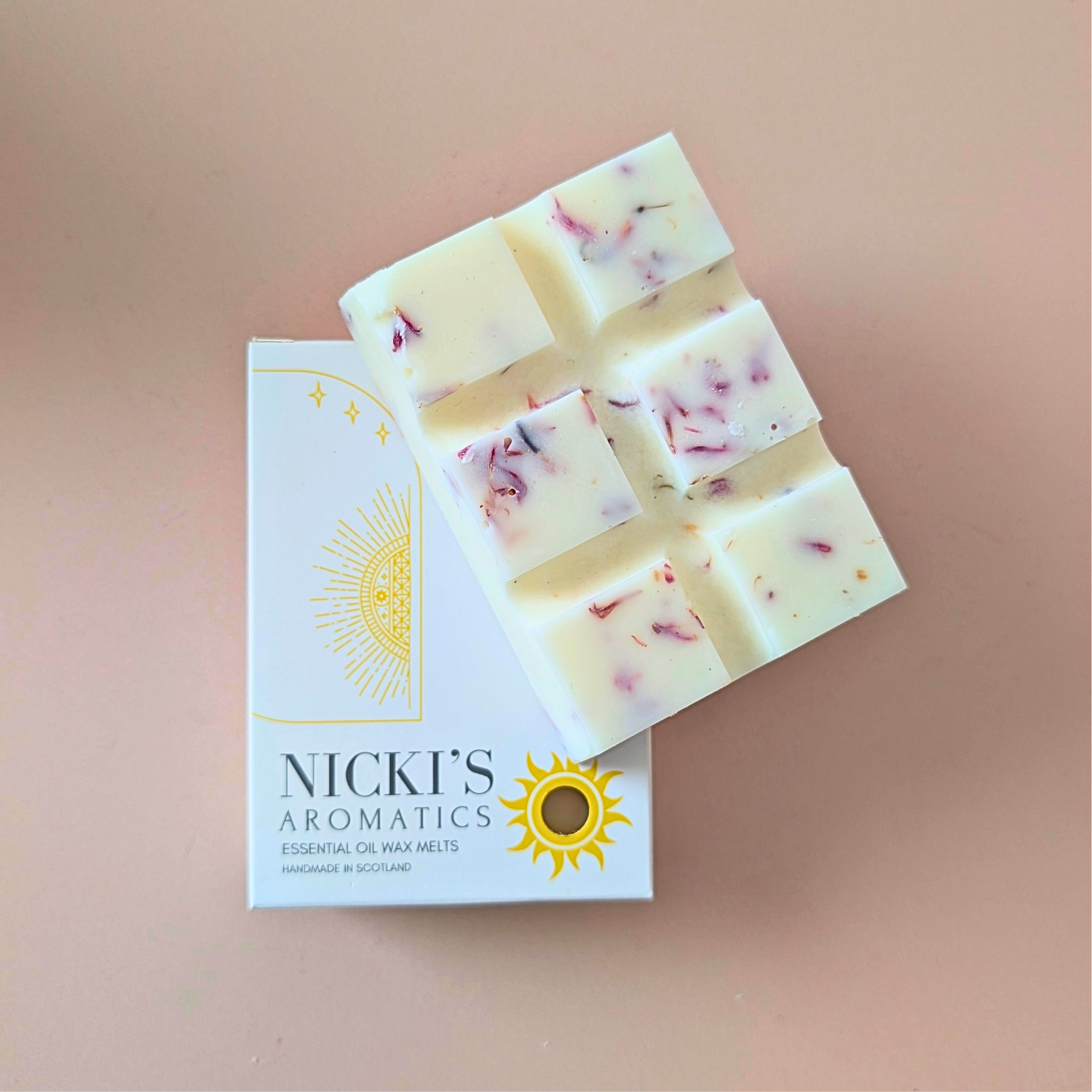 Bliss essential oil wax melt bar with botanical details in Nicki’s Aromatics packaging