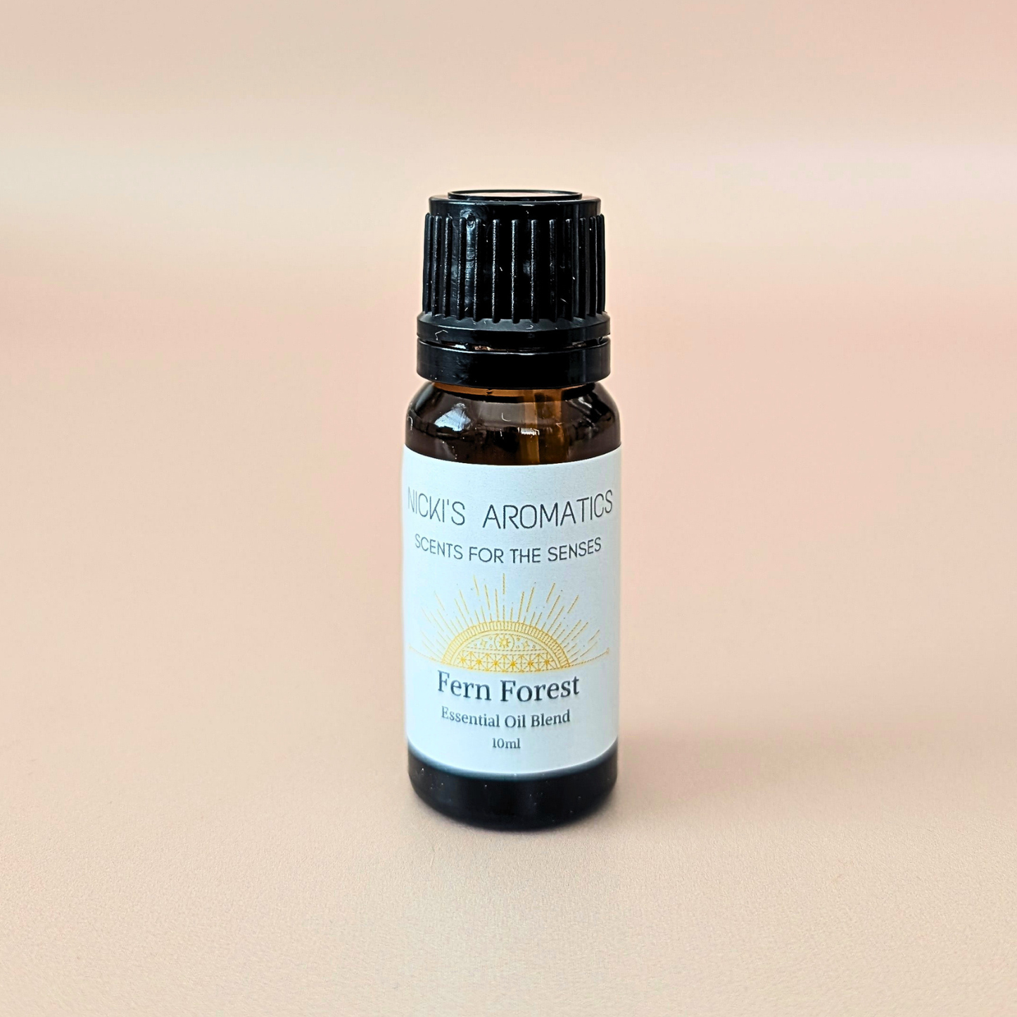 Fern Forest pure essential oil blend with bergamot, ylang-ylang and cedarwood in a 10ml amber glass bottle