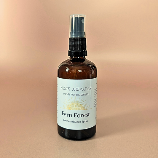 Fern Forest natural room and linen spray with bergamot, ylang-ylang and cedarwood in an amber glass bottle