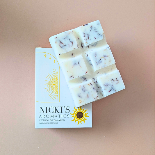 Inspire essential oil wax melt bar with botanical details in Nicki’s Aromatics packaging