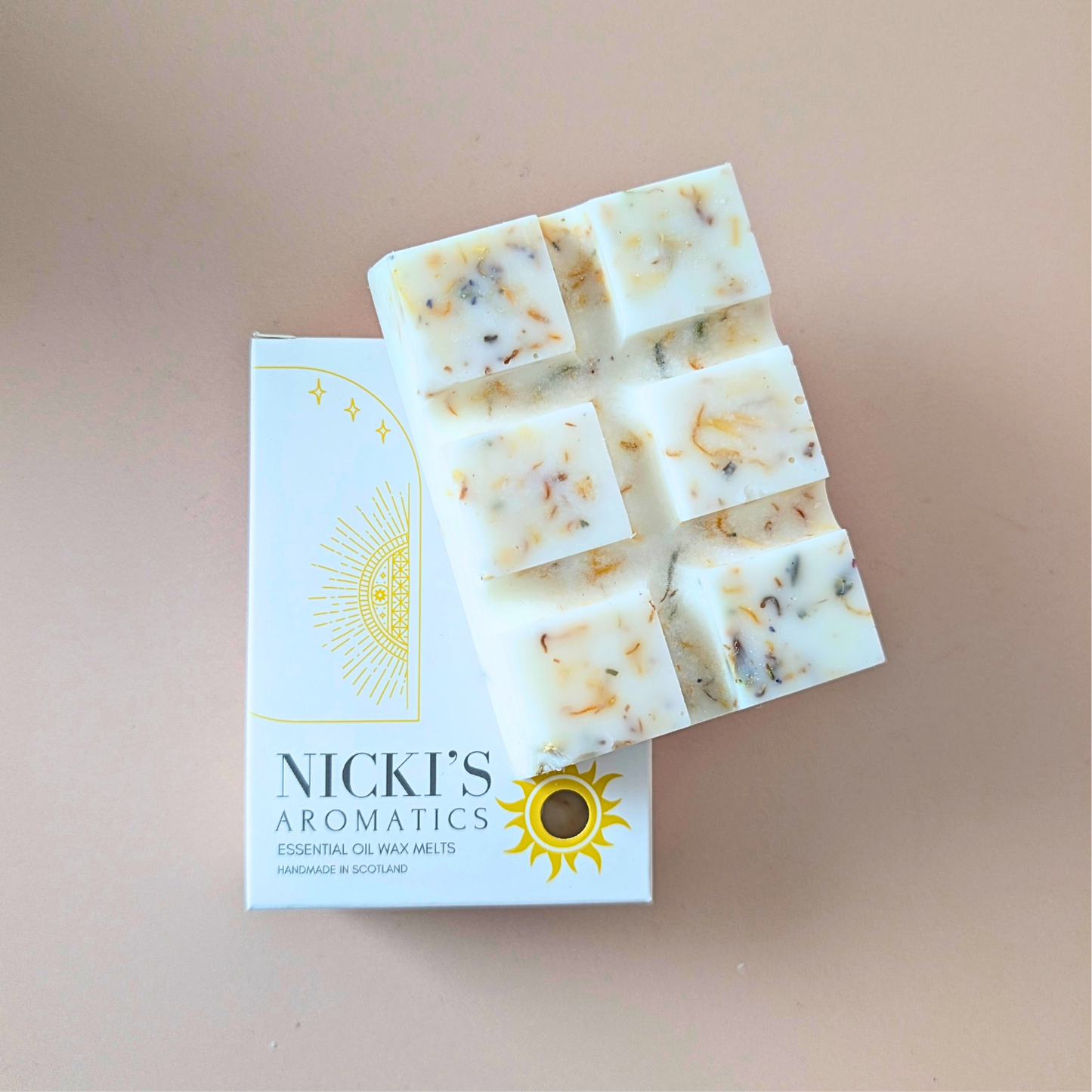 Lavender Dream essential oil wax melt bar with botanical details in Nicki’s Aromatics packaging