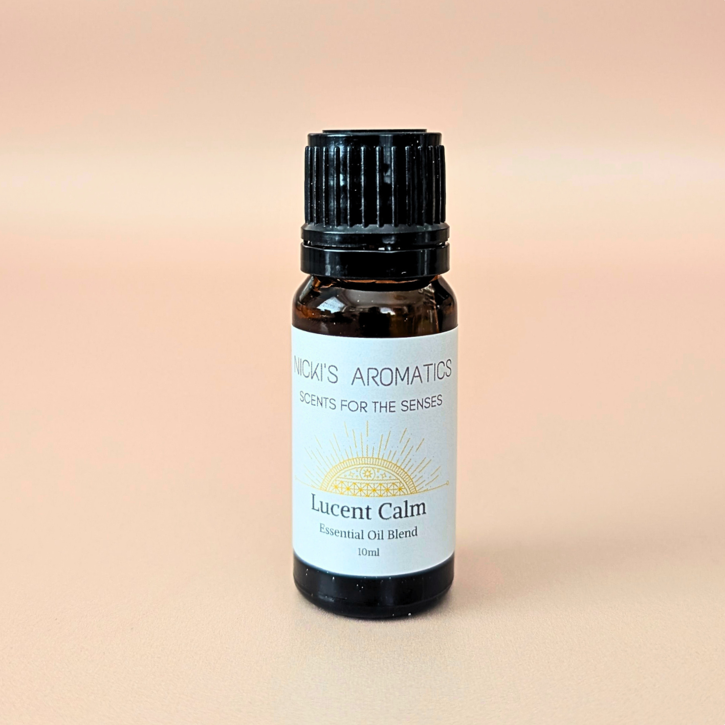 Lucent Calm pure essential oil blend with mandarin, lime and lavender in a 10ml amber glass bottle