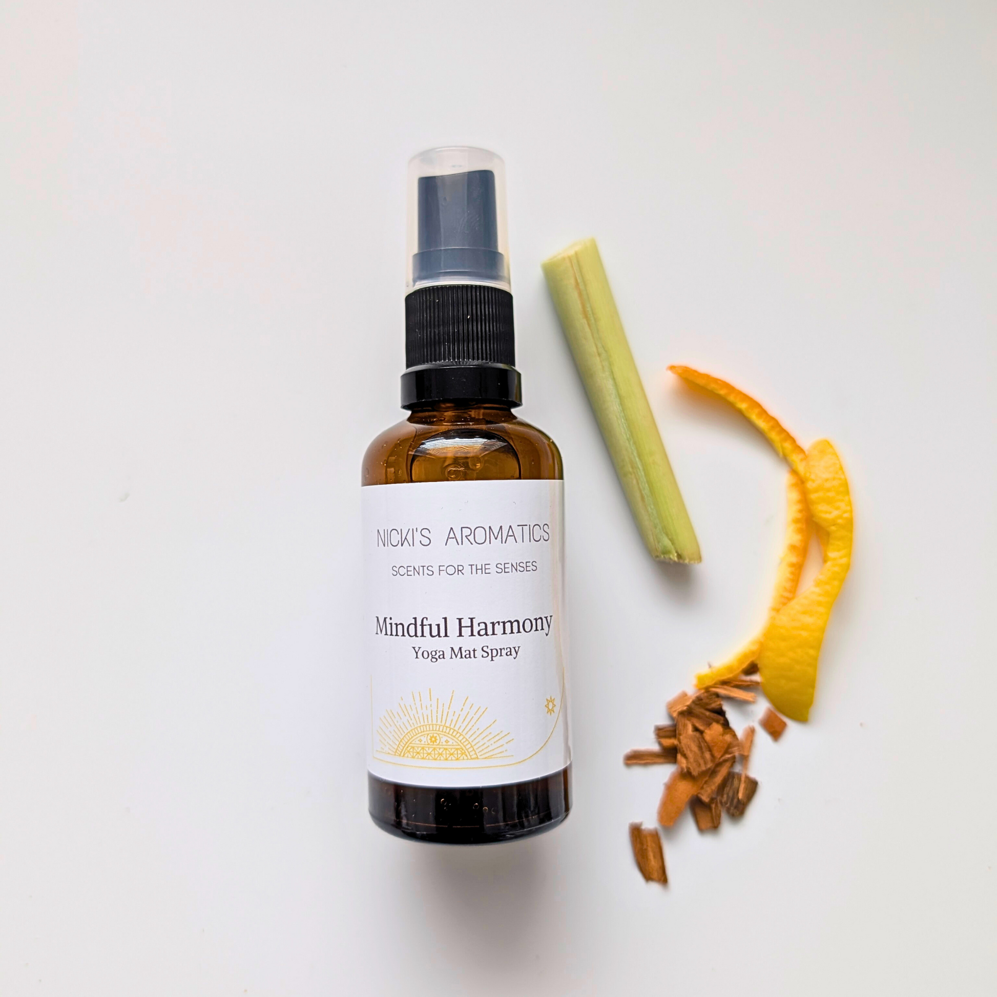 50ml amber glass bottle of a yoga mat spray with natural ingredients to the right