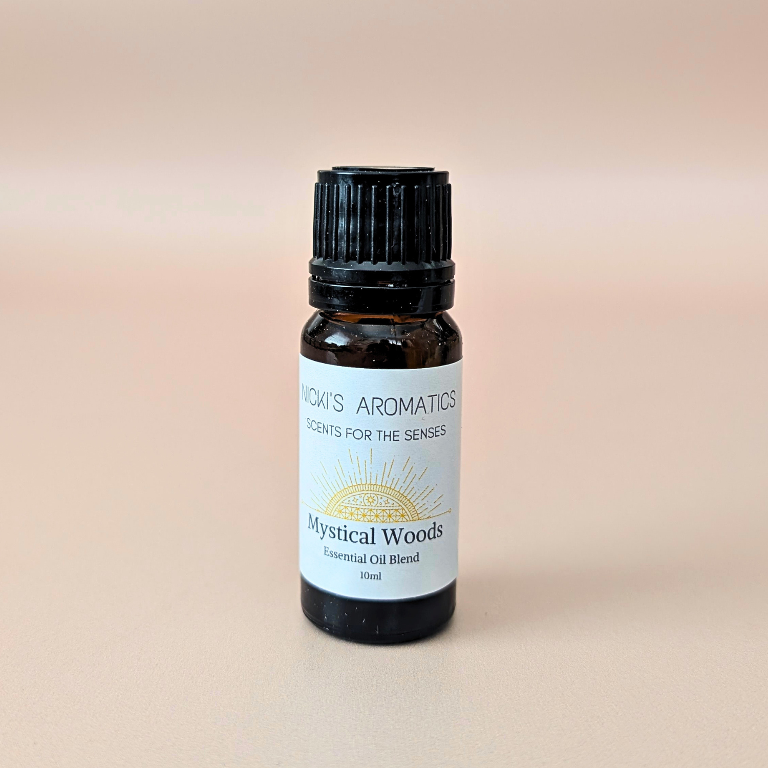 Aurora Grove pure essential oil blend with grapefruit, rosewood and cedarwood in a 10ml amber glass bottle