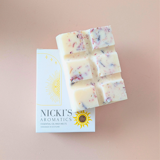 Peony Bloom essential oil wax melt bar with botanical details in Nicki’s Aromatics packaging