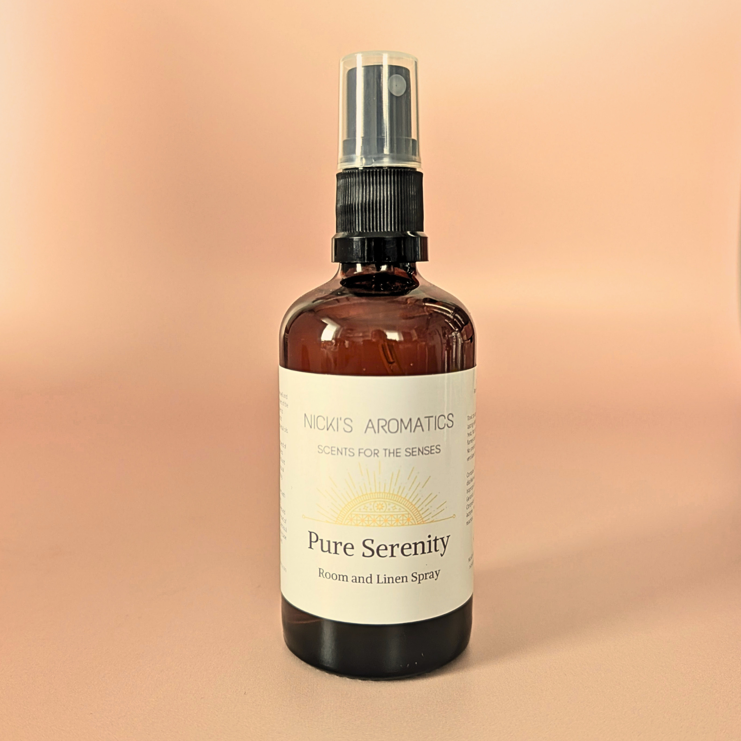 Pure Serenity natural room and linen spray with bergamot, lily and vetiver in an amber glass bottle