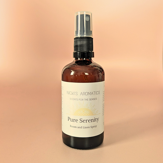 Pure Serenity natural room and linen spray with bergamot, lily and vetiver in an amber glass bottle