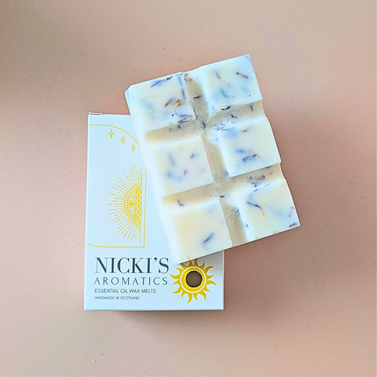 Pure Serenity essential oil wax melt bar with botanical details in Nicki’s Aromatics packaging