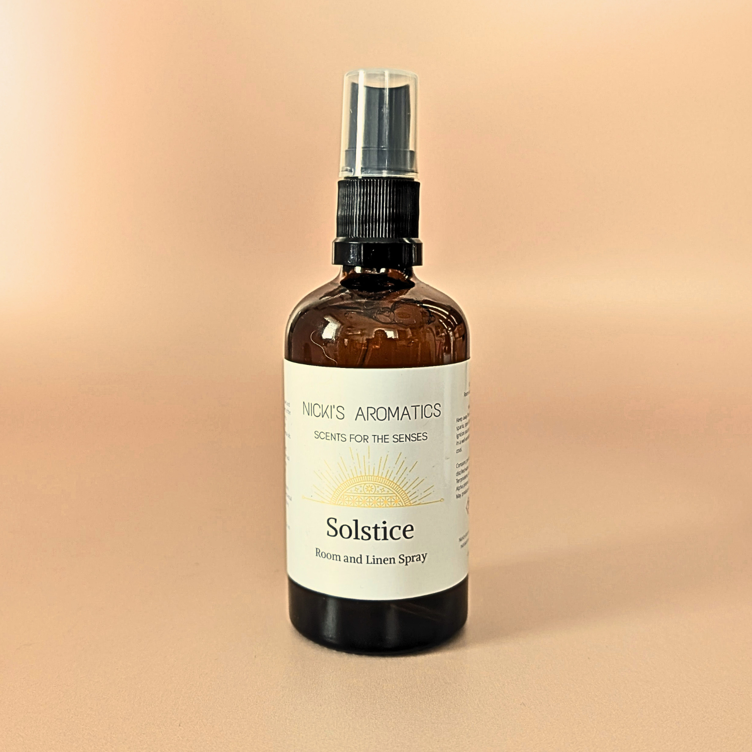 Solstice natural room and linen spray with lime, mandarin and basi in an amber glass bottle