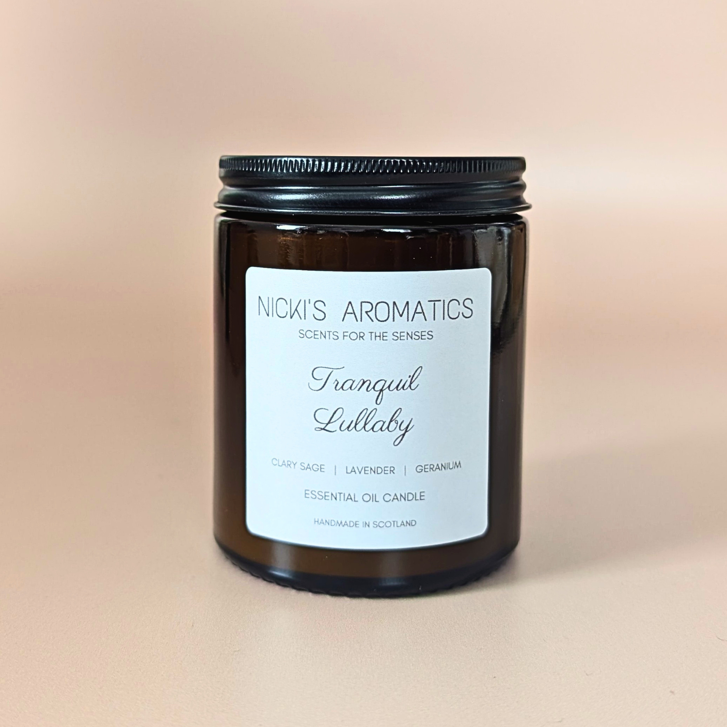 Tranquil Lullaby essential oil candle with clary sage, lavender and geranium in an amber glass jar