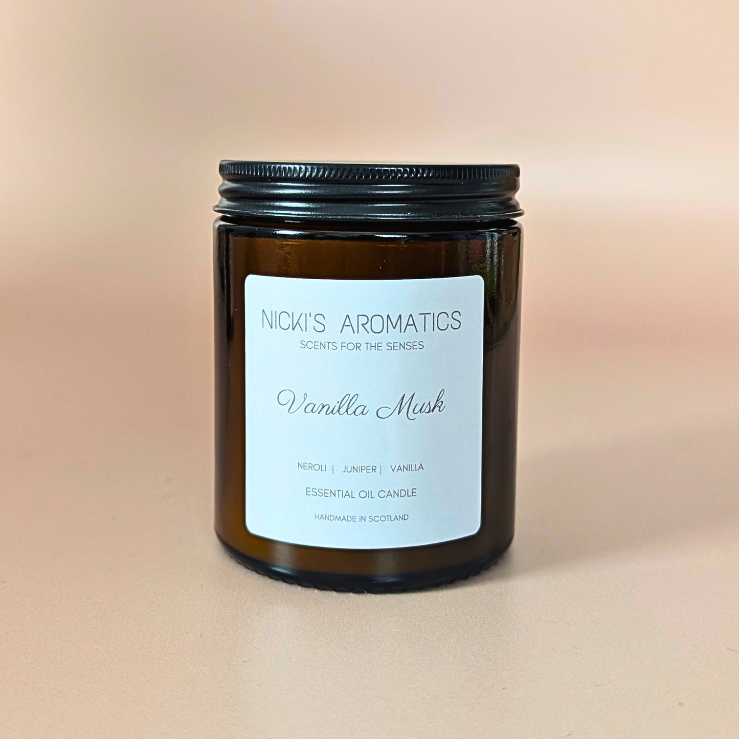Vanilla Musk essential oil candle with neroli, juniper and vanilla in an amber glass jar