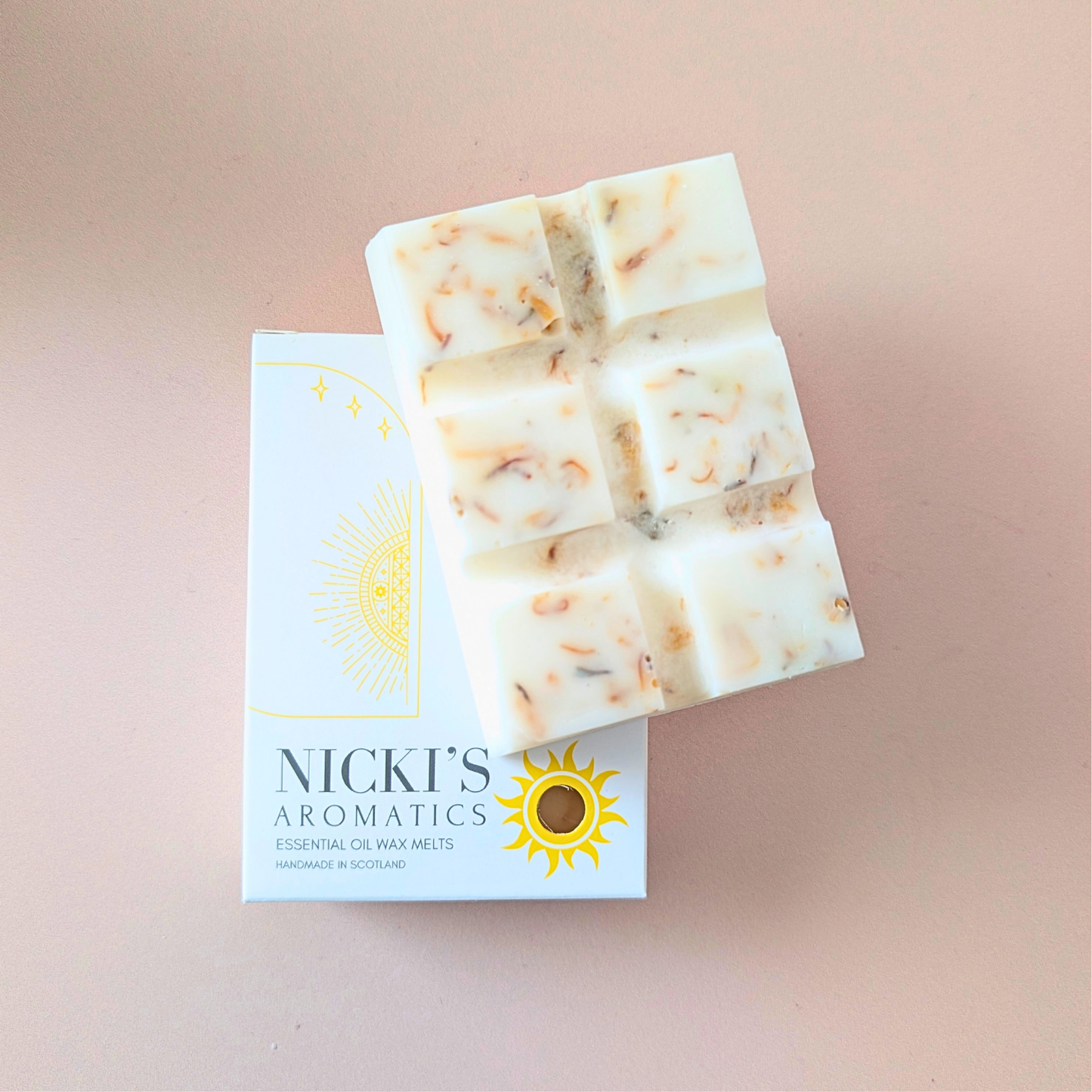 Vanilla Musk essential oil wax melt bar with botanical details in Nicki’s Aromatics packaging