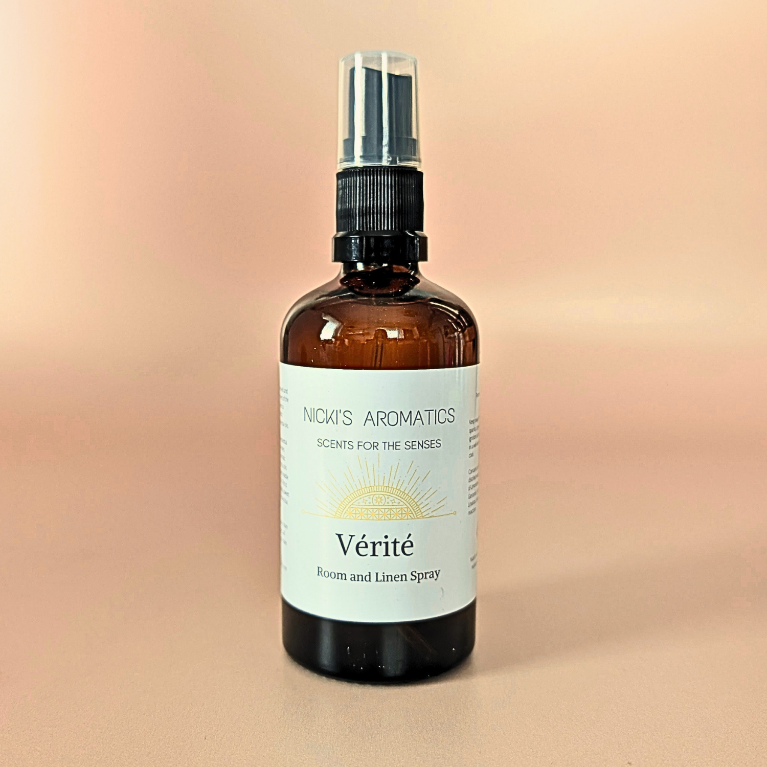 Verite natural room and linen spray with lemongrass, palmarosa and patchouli in an amber glass bottle