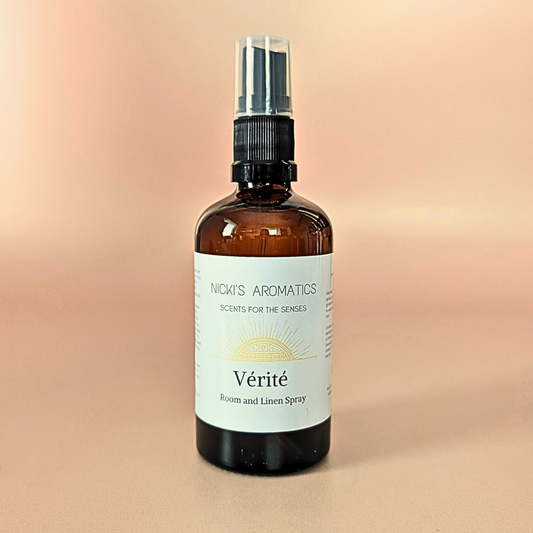Verite natural room and linen spray with lemongrass, palmarosa and patchouli in an amber glass bottle