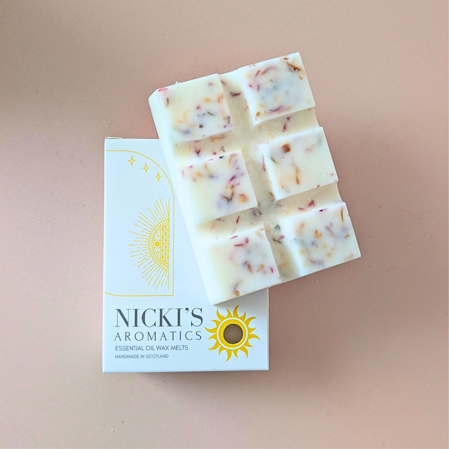 Verite essential oil wax melt bar with botanical details in Nicki’s Aromatics packaging