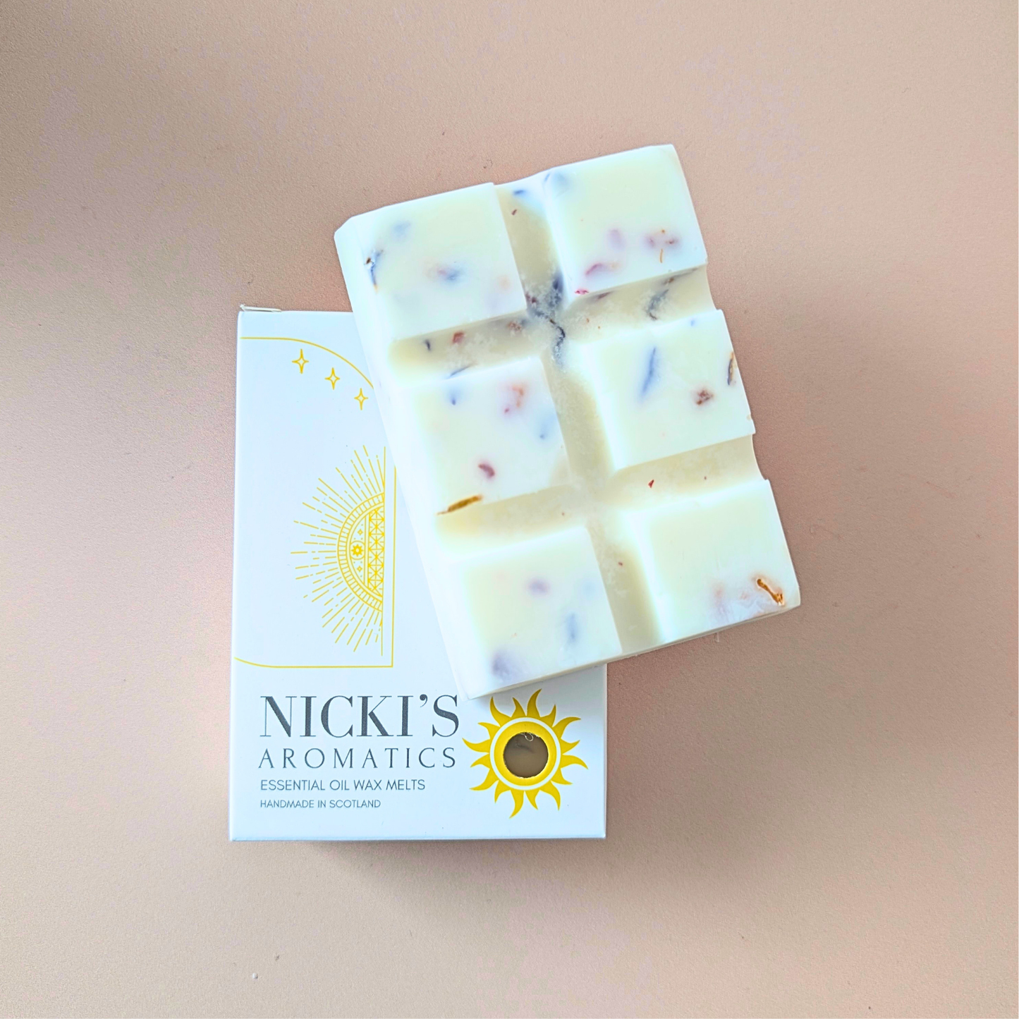Wild Meadow essential oil wax melt bar with botanical details in Nicki’s Aromatics packaging
