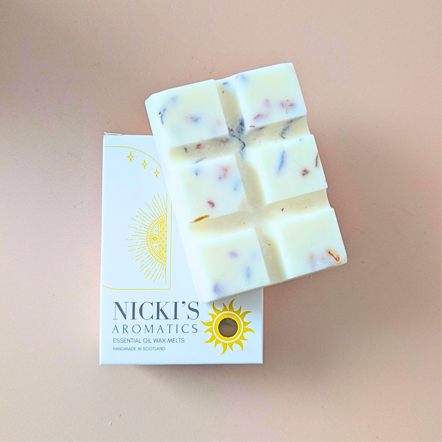 Wild Meadow essential oil wax melt bar with botanical details in Nicki’s Aromatics packaging