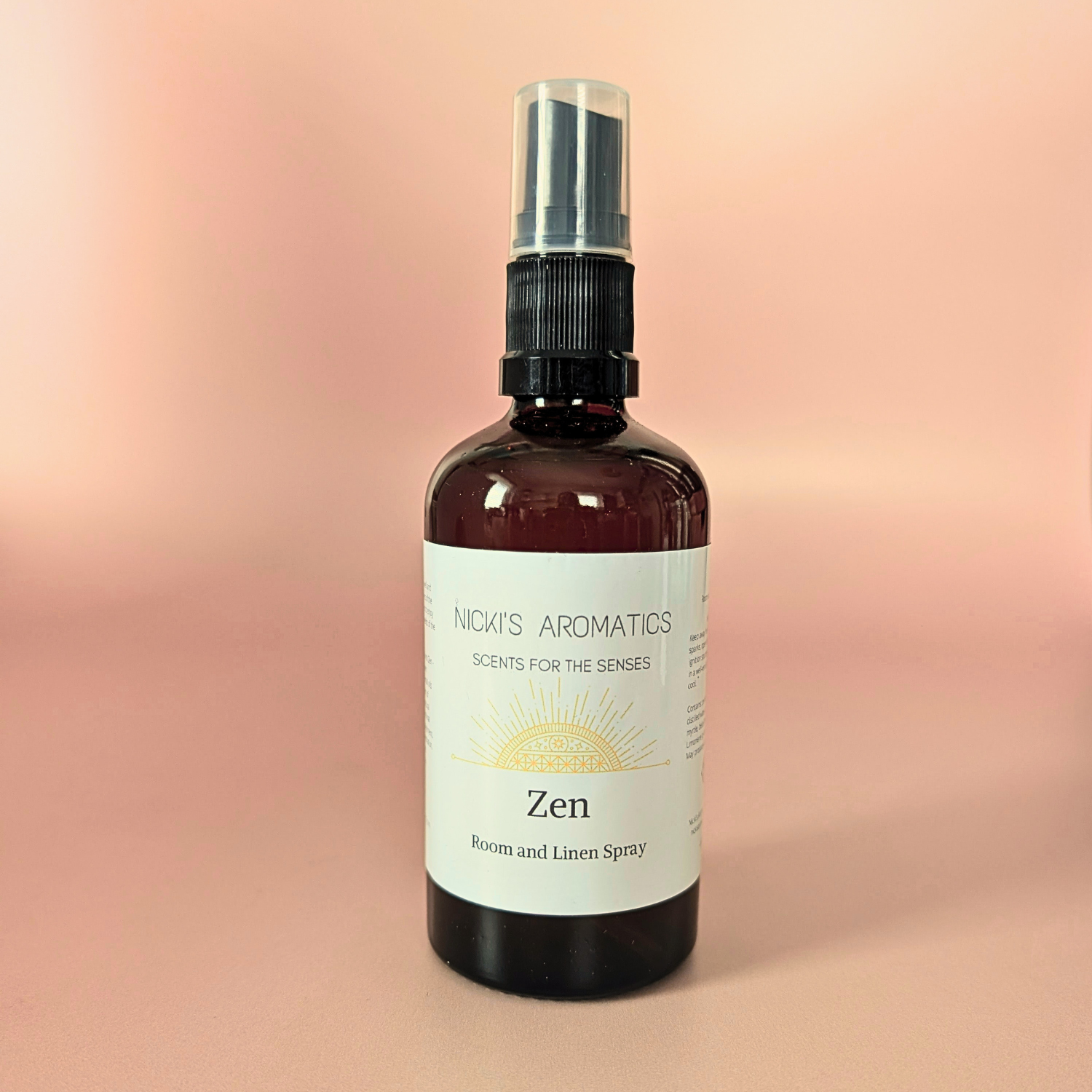 Zen natural room and linen spray with citrus and patchouli in an amber glass bottle